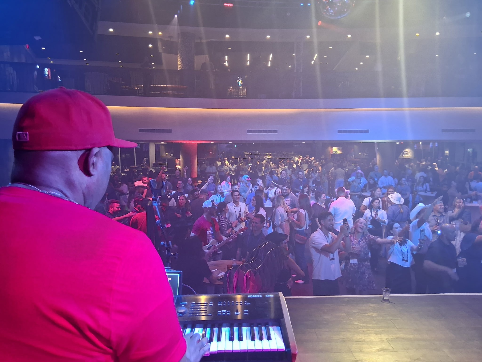 Guests enjoying a live Decades performance, seen from the stage