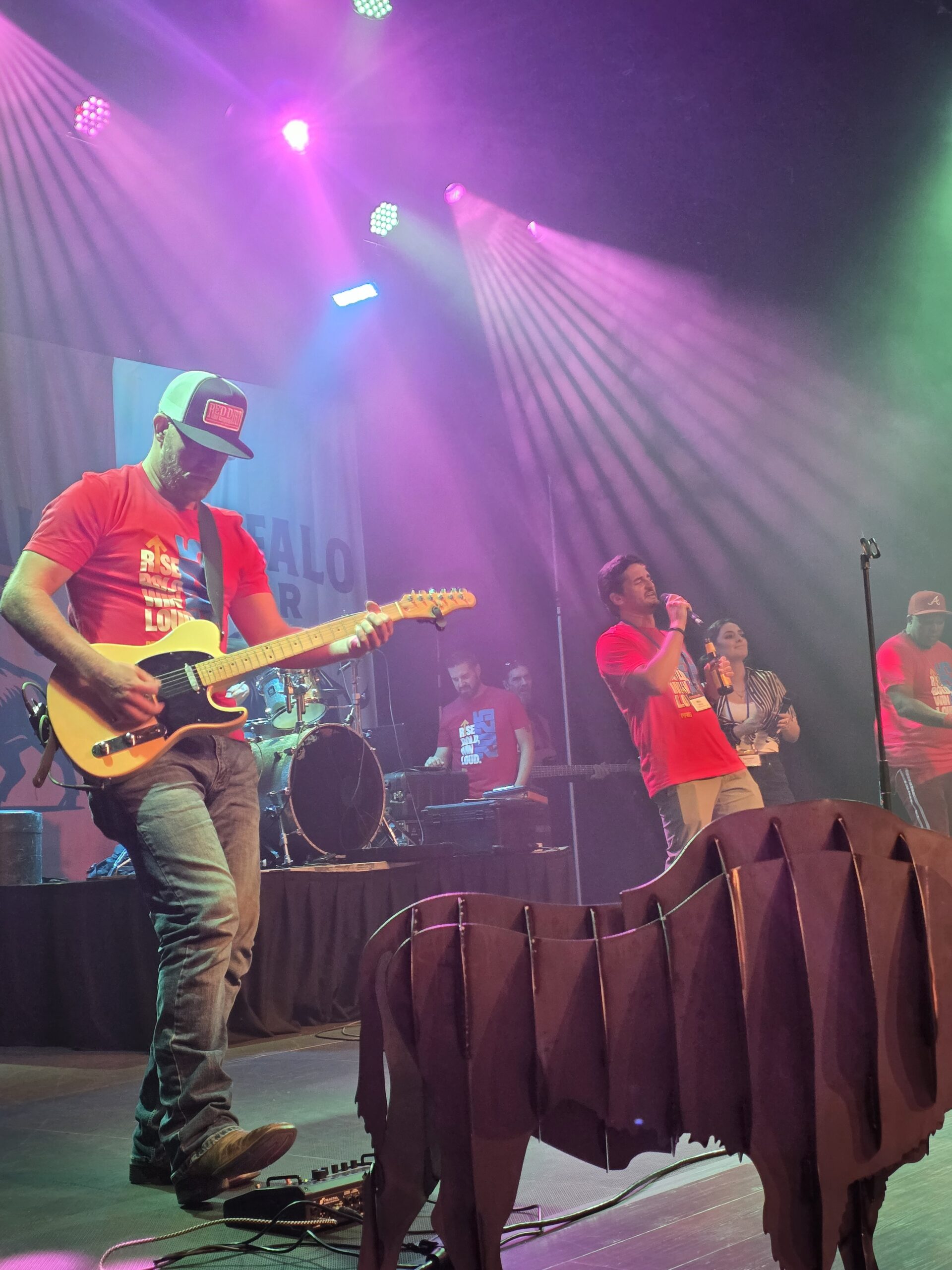 Guest singers performing beside the live guitarist, drummer and keyboard player